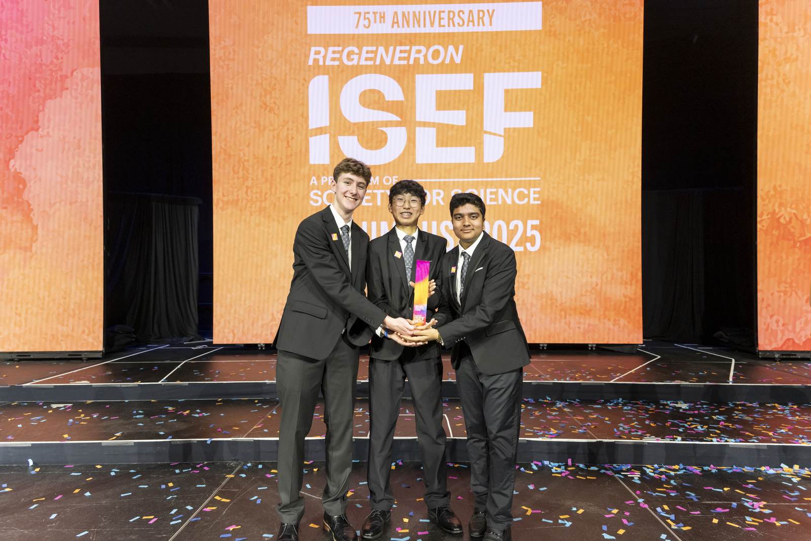 Samuel Skotnikov and his teammates receiving the Gordon E. Moore Award on stage